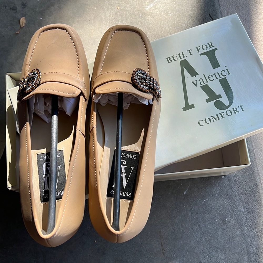 New worn brown flat loafer with buckle
